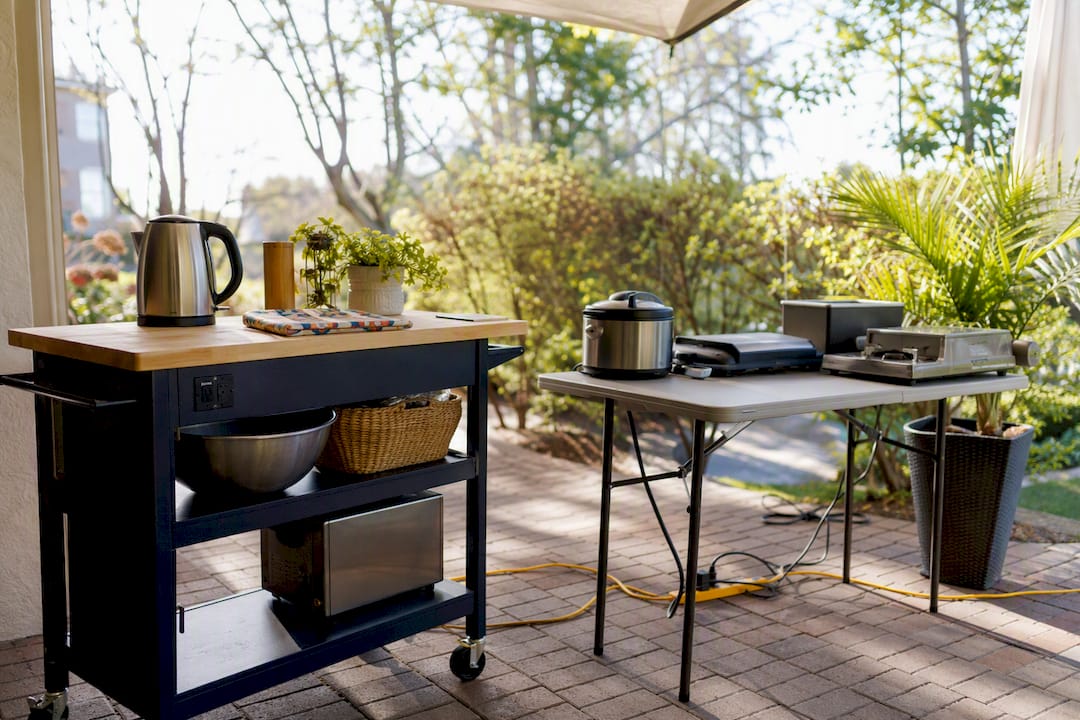 Rolling cart and folding table in temporary kitchen