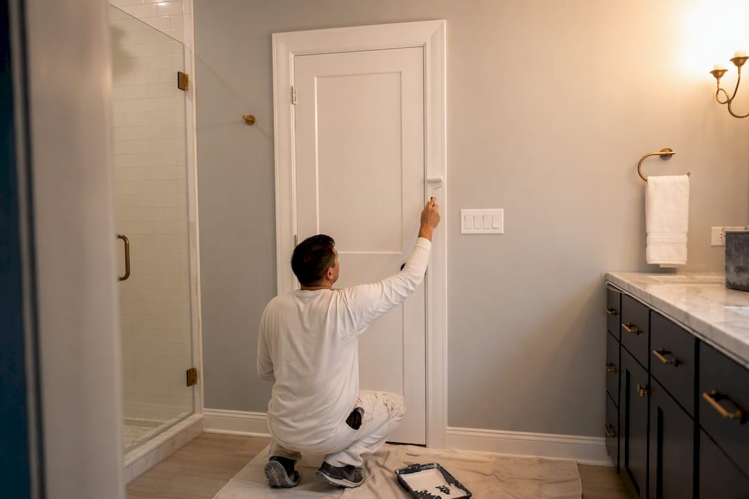 Hands sanding door trim for semi-gloss paint