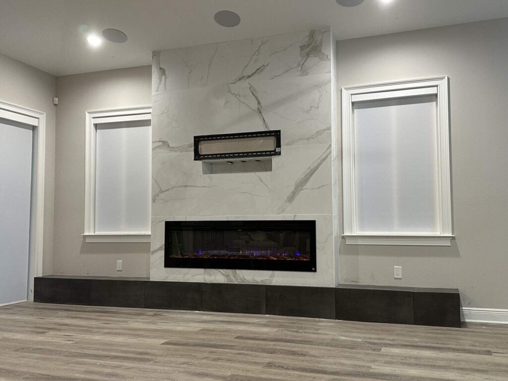 Fireplace remodel Tampa Bay: marble slab feature wall with a linear fire