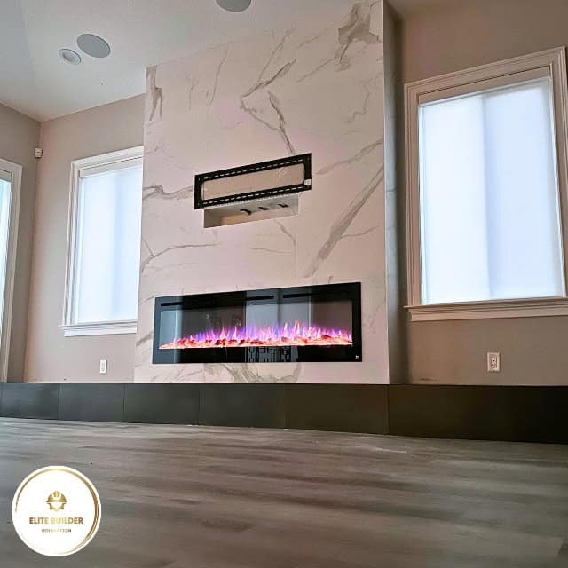 Fireplace remodel Tampa Bay: finished marble slab surround with a linear electric fire