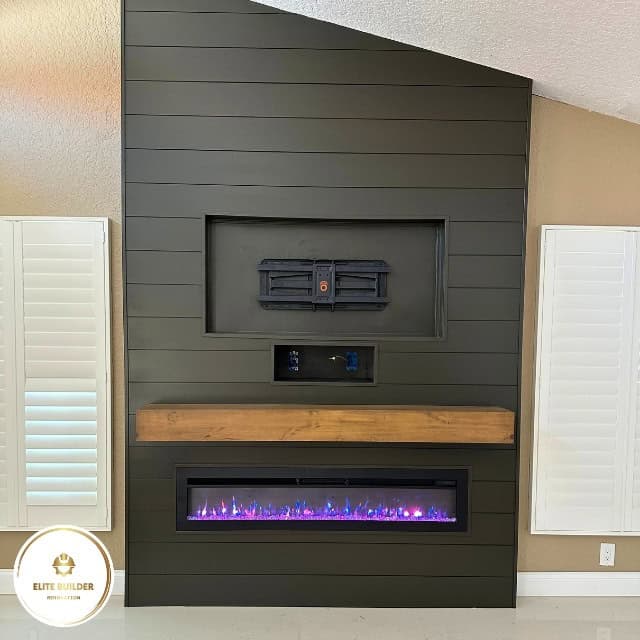 Fireplace remodel Tampa Bay: finished dark shiplap feature wall with a floating timber mantel