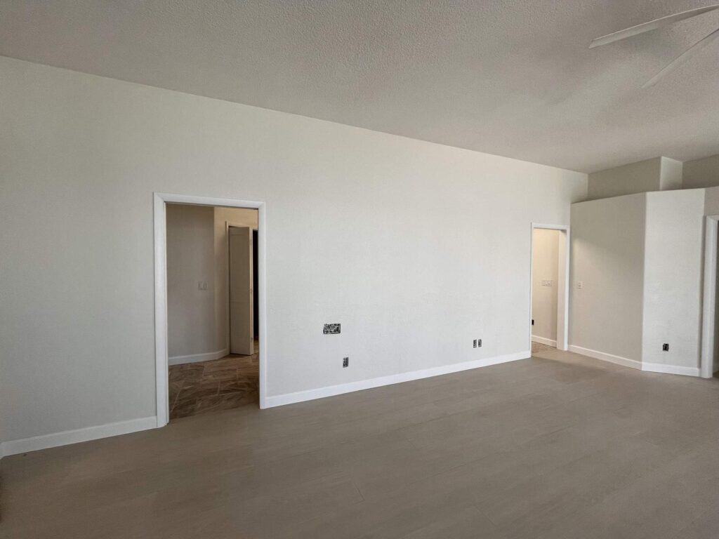 Flooring contractor Tampa Bay: one finished floor carried through every doorway