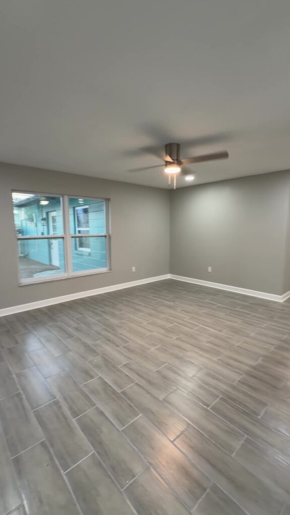 Flooring contractor Tampa Bay: plank flooring through a finished open living area in Madeira Beach